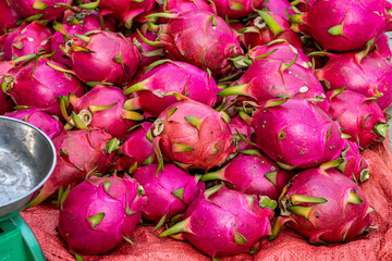 Vietnam, exotic Dragon Fruits  on a market stall.