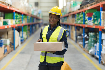 A female worker sorting goods in a warehouse.