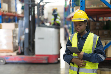 Female employee holding a tablet to inspect.