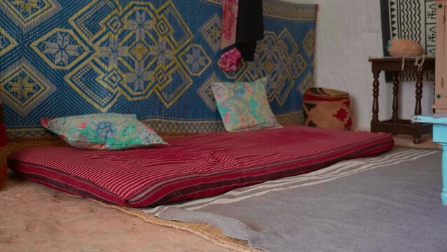 Close up of traditional old house inside bedroom in underground cave. Humble utilities in a home from Matmata.