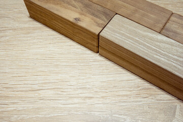 Wooden blocks on wooden table. Geometric background.
