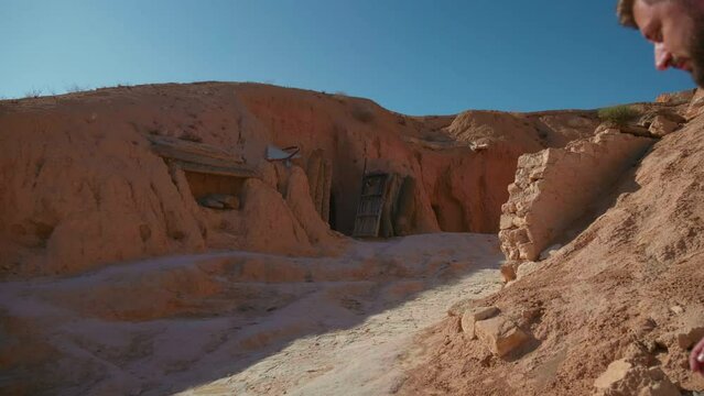 In the yard of inhabitants settlement in old Matmata. Underground houses of old natives in North Africa visited by tourists.