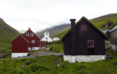 Fototapeta na wymiar Typical houses of Elduvik on the island of Eysturoy, Faroe Islands, Denmark