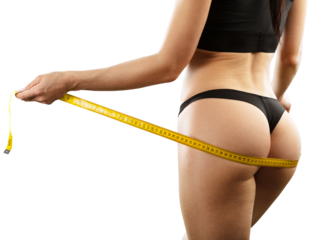 Woman with slim body measuring her waistline. Healthy weight concept.