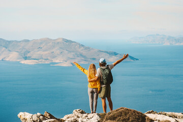 Couple man and woman hiking together outdoor travel lifestyle active summer vacations tourists...