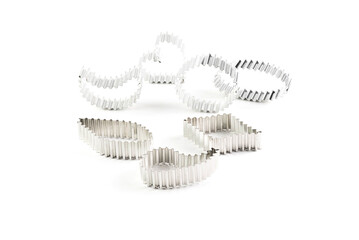 On a white background, metal figures of various shapes for cutting cookies.