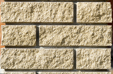 Textured background of natural stone wall. Beige stone wall.