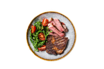 BBQ Grilled rib eye steak, fried rib-eye beef meat on a plate with green salad.  Isolated,...