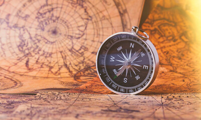 Fototapeta na wymiar Looking for adventure. Compass and maps. Treasure map and path to the treasure.