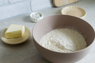 Ingredients for making Pampushky, traditional Ukrainian buns for borsch. Flour, yeast, butter, salt. The concept of traditional dishes. Horizontal orientation.