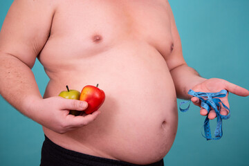 Diet and healthy lifestyle. Funny fat man takes care of his health.