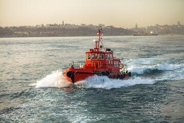 Red boat in the Bosphorus channel in Istanbul, Turkey