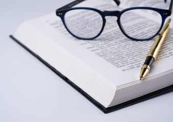 Education Concept With Open Book Glasses and pencil