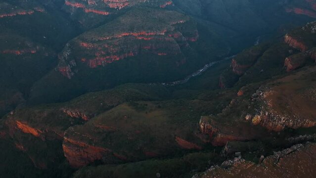 Aerial view of Blyde River Canyon with low clouds, a natural attraction with mountains and wildlife, South Africa.