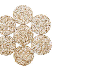 Rice cakes are laid out in the shape of a flower on a white background. Diet snack with a minimum amount of calories, consisting of crispy rice. Free space for text and ads