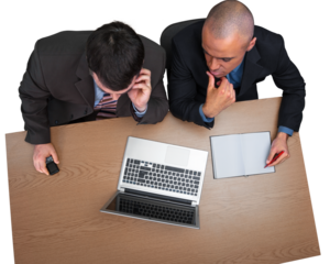 Business men using laptop while making report in office