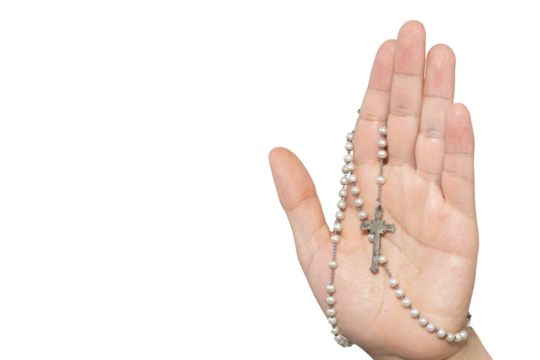 Palm of a white hand holding a rosary on a white background
