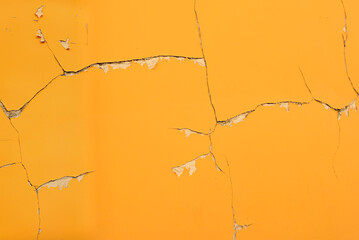 Orange yellow paint background with cracks