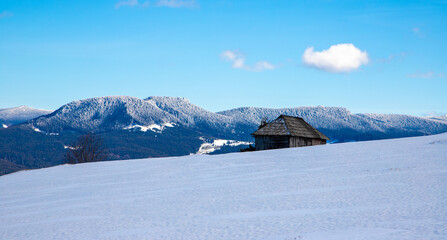 Landscape of a wooden hut on the mountain in winter