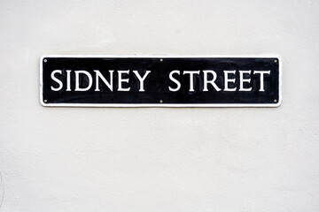 street name sign on wall
