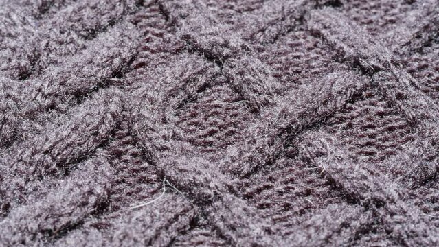 Knitted warm grey sweater or scarf macro close up texture, Cozy warm composition of Wool fabric texture close up, Comfortable style cloth cotton.