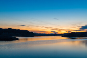 Fototapeta na wymiar Beautiful sunset over the lake. Panoramic sunset landscape.
