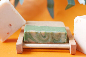 Homemade natural soap bar on black background 