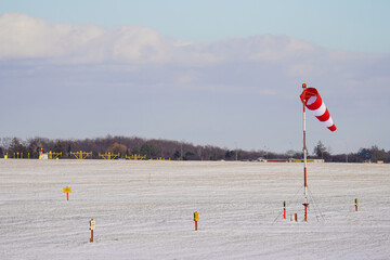 Windsock indicator of wind on runway airport. Wind cone indicating wind direction and force...