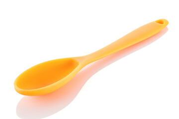 Pastry silicone tools, spoon over white background. Close-up