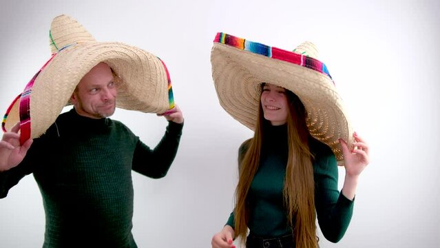 adult man and young girl hold on their heads sombrero hat spanish headdresses joy buy at time in dark green golfs on walk headdress sale clothes joyfully journey mexican holiday buenos muchachos