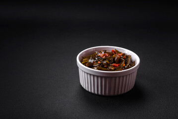 Delicious marinated seaweed with paprika, spices and salt