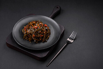 Delicious marinated seaweed with paprika, spices and salt
