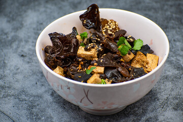 Wood ear mushroom and tofu bowl on gray table