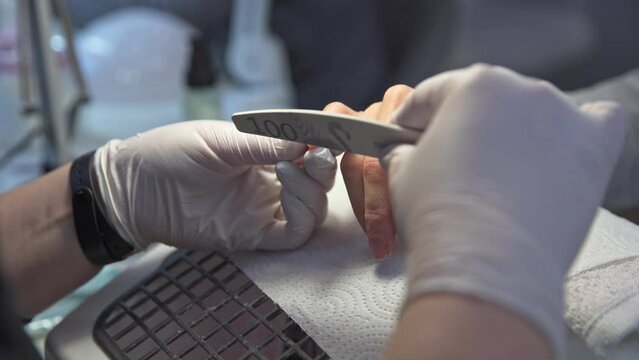 A woman in a beauty salon gets a beauty procedure