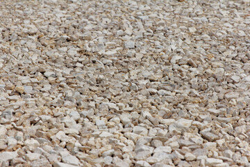 Gravel of large fractions Crushed stone building aggregate stone structure. Crushed Stone close-up Lies on ground. Breakstone