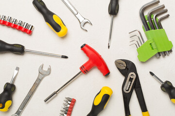 Set of tools on concrete background, top view
