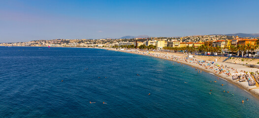 Fototapeta na wymiar Nice shore and beach panorama with Prom des Anglais boulevard, Le Carre d’Or and Les Baumettes district on Mediterranean Sea shore on French Riviera in France