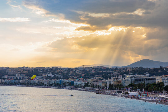 Nice shore and beach panorama with Prom des Anglais boulevard, Le Carre d’Or and Les Baumettes district under stormy sunset sky on French Riviera in France