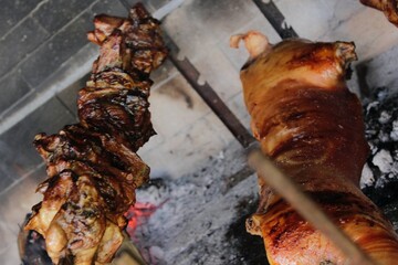 Grilled piglet and Sardinian suckling pig. Porceddu on the spit. Best red meat bbq party. Crunchy and toasted rind. Festival of roastyng and fire cooking