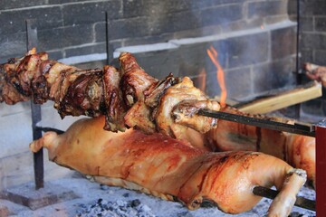 Grilled piglet and Sardinian suckling pig. Porceddu on the spit. Best red meat bbq party. Crunchy...