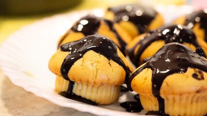 Home made glazed muffins with chocolate topping.