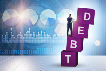 Debt and loan concept with businessman on cubes