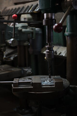 Part machining with drilling machine