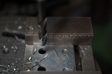 Part machining with drilling machine