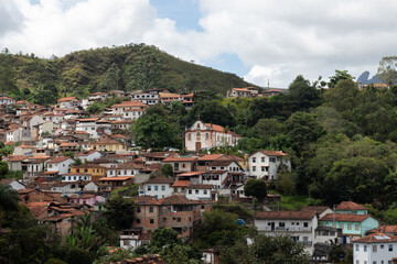 Fototapeta na wymiar Houses on the hill and a chapel in the historic town of Ouro Preto, Minas Gerais, Brazil - Casas e uma capela na cidade histórica de Ouro Preto, em MG, Brasil