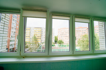  large glazed windows. interior of the balcony in the apartment. 