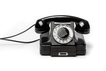 Vintage black telephone  on a white bachground.