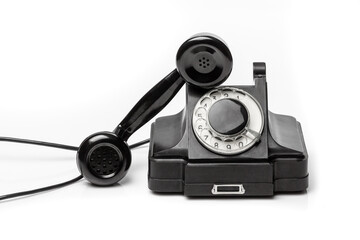 Vintage black telephone  on a white bachground.