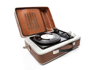 Vintage foldable portable vinyl player with a black sinlge vinyl plate on a turntable.