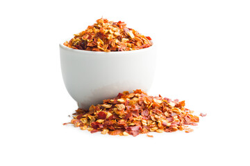 Dry chili pepper flakes in bowl. Crushed red peppers isolated on white background.